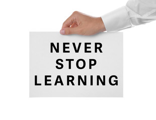 Man's hand holding white paper with text on white background. Business trainer