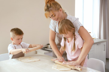 Mother and kids making biscuits