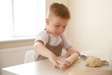 Fototapeta premium Little boy making biscuits