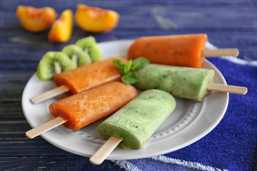 Tasty fruit ice-cream on plate, closeup
