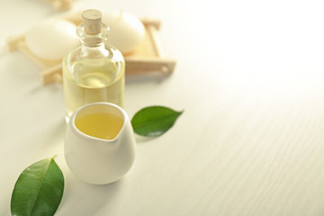 Fototapeta na wymiar Spa composition with tea tree oil on white background