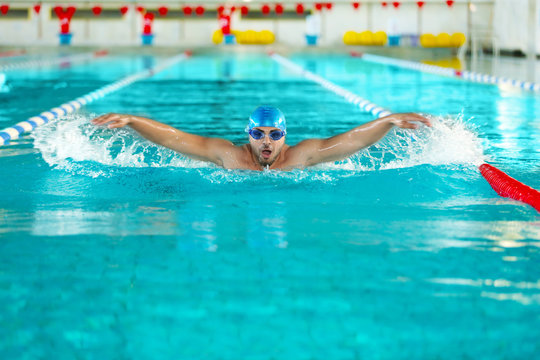 Young man swimming in pool