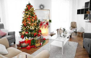 Cozy Christmas interior of living room with beautiful fir tree