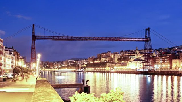 Bizkaia Bridge at night, Biscay, Basque Country, Spain. Time lapse day to night of the Hanging bridge, made in 1893, Unesco world heritage site. 
