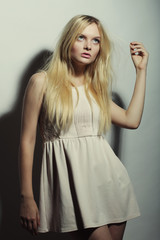 Fototapeta premium young magnificent woman in white dress.