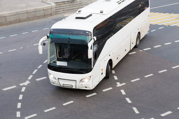 bus at the city intersection © Yuri Bizgaimer