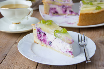 Homemade cheesecake with blueberries, pineapple, grapes and jelly. Russian quark cake