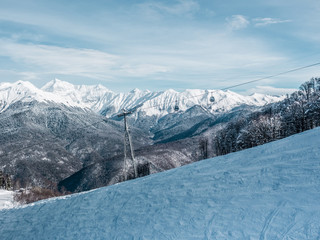 Fototapeta premium Winter landscape in mountains with cableway