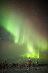Naklejka na ściany i meble Northern Lights in Lapland, Finland.