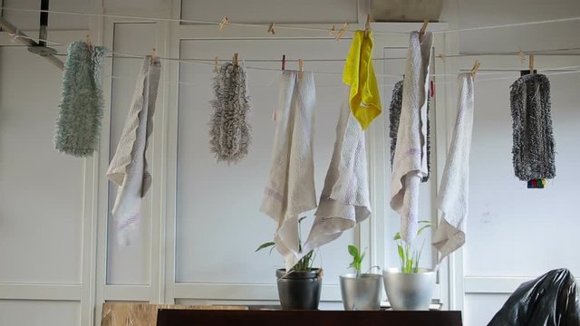 doormats are dried on the clothesline. towels on clothesline. cloth in the wind