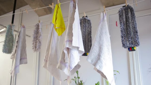 doormats are dried on the clothesline. towels on clothesline. cloth in the wind