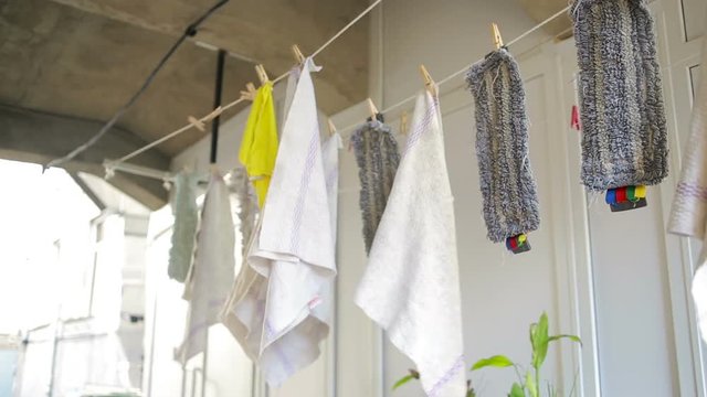 doormats are dried on the clothesline. towels on clothesline. cloth in the wind