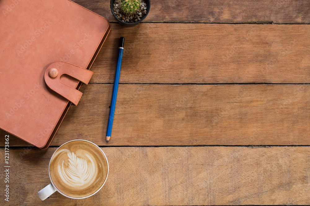 Poster office desk table with leather notebook, pencil and cup of coffee.top view with copy space.office su