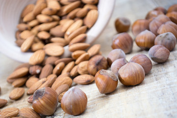 Spilled almonds and hazelnuts from the bowl