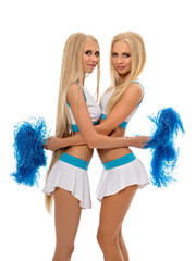 Studio photo of sexy cheerleaders hugging