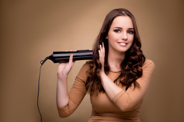 Beautiful woman with hair dryer
