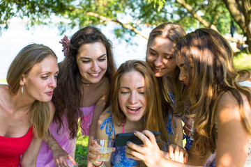 Young girls look in phone and lovely smile, a hen night