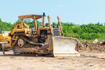 Closeup skid steer loader excavator at road construction work