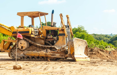 Closeup skid steer loader excavator at road construction work