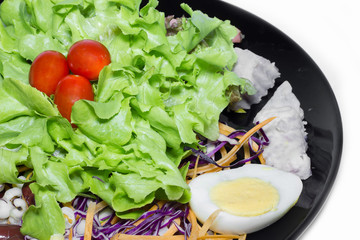 Fresh vegetable salad on white background.