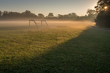 Misty morning soccer field