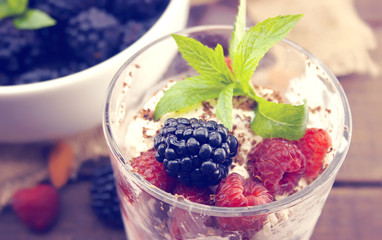 Vanilla ice cream with fresh ripe berries and grated chocolate.