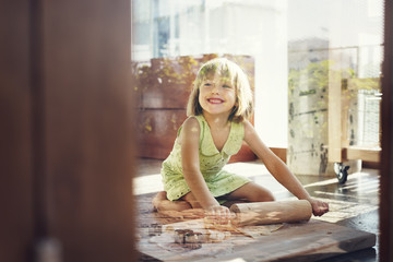 Little Girl Smiling Bake Cookie Concept