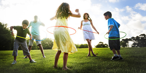 Whole Family Hula Hooping Outdoors Togetherness Concept