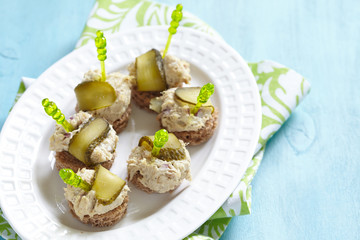 Canapes with fish pate and pickle
