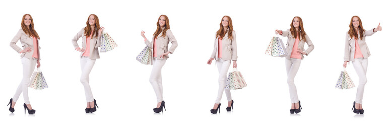 Young woman with shopping bags isolated on white
