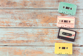 Top view (above) shot of retro tape cassette on wood table - vintage pastel color effect styles
