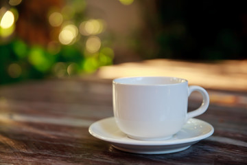 Cup of coffee on a wooden table.