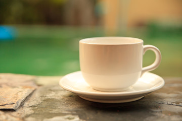 Cup of coffee on a wooden table.