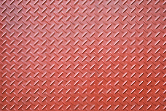 Metal diamond plate or old checkered steel plate with rustproof coating well. background. texture.