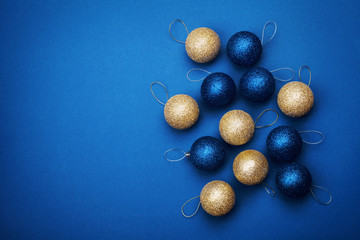 Christmas ball on blue background from above. Flat lay style.