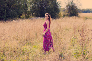 Obraz premium Nice girl and a field in a nice day