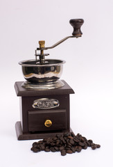 Coffee grinder winch with coffee bean on white background