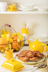 Breakfast. Cottage cheese pancakes with tea and lemon.