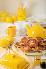 Breakfast. Cottage cheese pancakes with tea and lemon.
