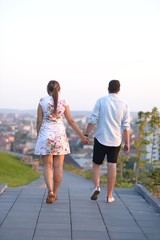Couple walking holding hands