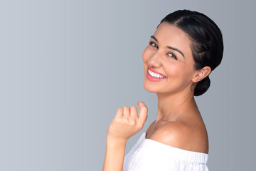 Beautiful natural fun vibrant hispanic woman smiling perfect skin teeth isolated space