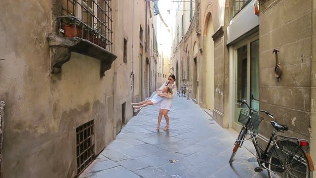 Family in Europe. Happy mother and little adorable girl having fun in Rome during summer italian vacation