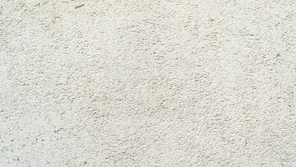 Surface of the wall, covered with textured plaster