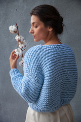 Streetstyle woman wearing colorful knitted jacket