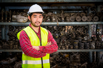 Portrait of Asian worker in Factory warehouse car parts.