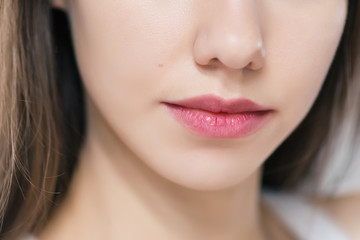 Fototapeta premium Beautiful female lips, close up. Selective focus.