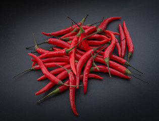 Red hot chili pepper on a dark background.