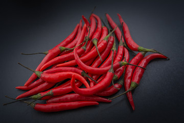 Red hot chili pepper on a dark background.