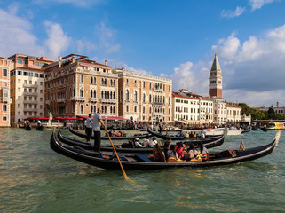Fototapeta na wymiar Gondola ride tourists, the Grand Canal, Venice