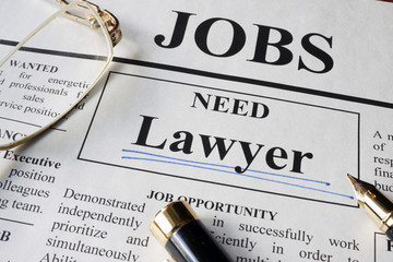 Newspaper with ads for vacancy Lawyer. Employment concept.